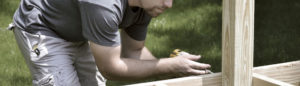 Photo of a building contractor assembling framing for a deck